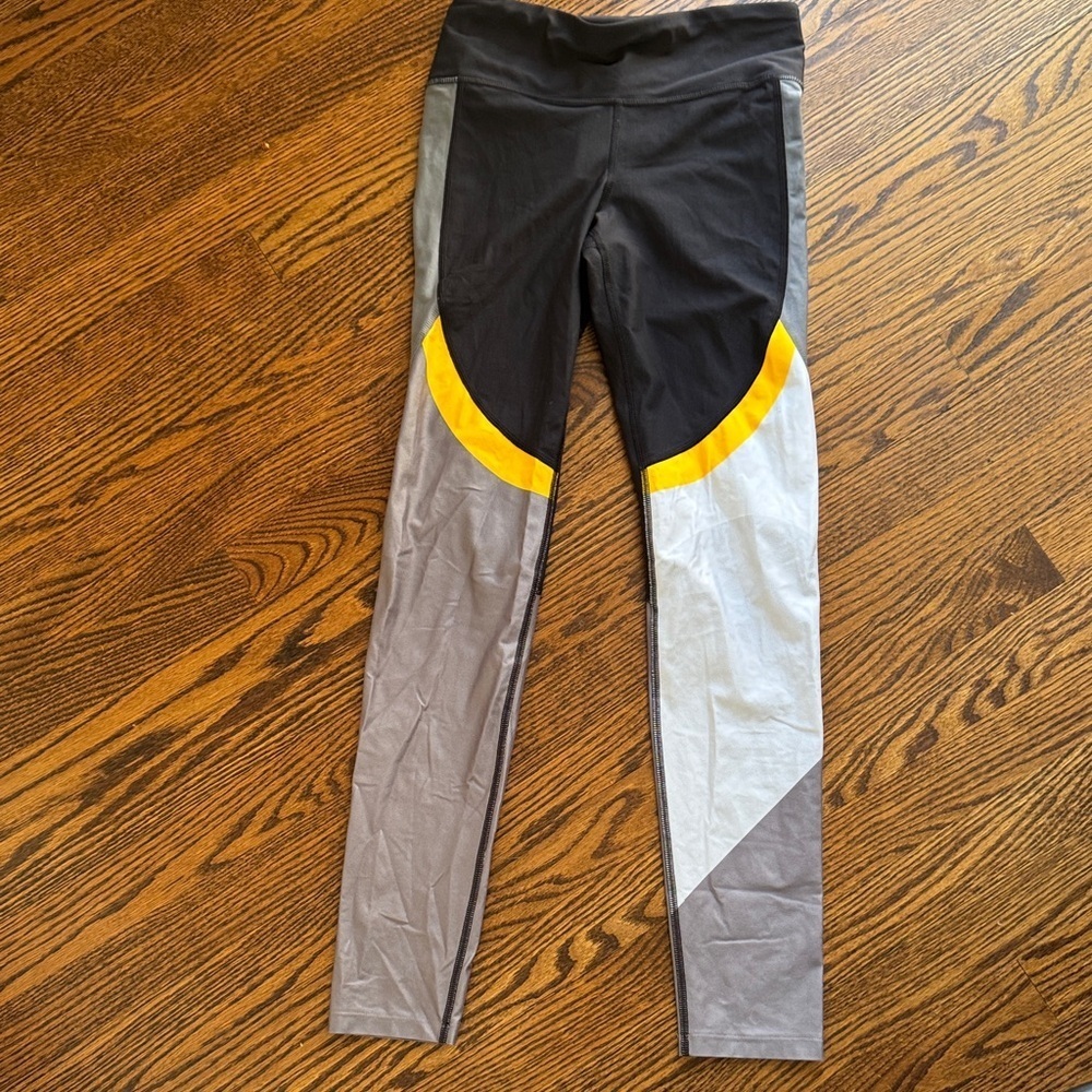 Under Armour black/gray/white/gold colorblock full length workout leggings Small